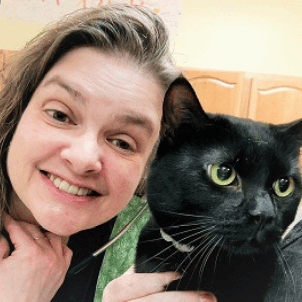 careers page 4 vet taking a selfie with a black cat